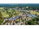 Expansive aerial view of the golf course and clubhouse highlighting the landscaping and surrounding community at 325 Hogans Valley Way, Cary, NC 27513