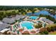 Stunning aerial view of a community pool, with pools, cabanas, and lounge chairs throughout the pool area at 325 Hogans Valley Way, Cary, NC 27513