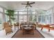 Relaxing sunroom with wicker furniture, tile floors, and lots of natural light at 325 Hogans Valley Way, Cary, NC 27513