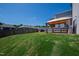 Grassy backyard with gazebo, wood fence, and patio at 33 White Ash Dr, Clayton, NC 27527