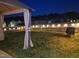 Backyard with lit fence, gazebo, and grill at 33 White Ash Dr, Clayton, NC 27527