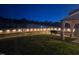 Backyard at night featuring a wooden fence strung with lights at 33 White Ash Dr, Clayton, NC 27527