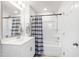 Bathroom featuring a single sink, bathtub, shower, and a mirror at 33 White Ash Dr, Clayton, NC 27527