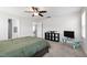 Bedroom featuring a ceiling fan, carpet, television, and a black bookshelf at 33 White Ash Dr, Clayton, NC 27527
