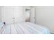 Bedroom featuring a white closet door and blue and white patterned bedding at 33 White Ash Dr, Clayton, NC 27527