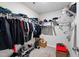 Walk-in closet featuring ample shelving and rod space for storage at 33 White Ash Dr, Clayton, NC 27527