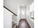 Bright entryway featuring a hardwood floor, staircase, and natural light from a window at 33 White Ash Dr, Clayton, NC 27527