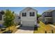Charming two-story home with a well-maintained lawn and attached garage, perfect for suburban living at 33 White Ash Dr, Clayton, NC 27527