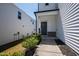 A welcoming front entrance to a well-maintained home with neat landscaping and a cozy porch at 33 White Ash Dr, Clayton, NC 27527
