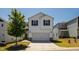 Charming two-story home with a manicured lawn, two-car garage, and a bright, modern exterior at 33 White Ash Dr, Clayton, NC 27527