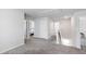 Upstairs hallway with neutral carpet, white doors, and a view into one of the bedrooms at 33 White Ash Dr, Clayton, NC 27527