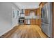 Modern kitchen featuring stainless steel appliances and warm wood cabinetry at 3312 Apache Dr, Raleigh, NC 27609
