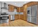Spacious kitchen featuring stainless steel appliances and ample cabinet space at 3312 Apache Dr, Raleigh, NC 27609