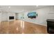 Finished basement with fireplace and mounted TV, offering a cozy and modern entertainment area at 3420 Sheridan Dr, Durham, NC 27707