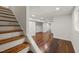 Spacious basement with hardwood floors, white walls, recessed lighting, and a staircase leading to the upper level at 3420 Sheridan Dr, Durham, NC 27707