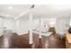 Finished basement with dark wood floors, a bedroom area, and white support columns at 3420 Sheridan Dr, Durham, NC 27707