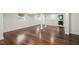 Finished basement with hardwood floors, multiple windows, and access to a bathroom and closet, ideal for a Gathering at 3420 Sheridan Dr, Durham, NC 27707