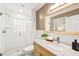 Bathroom featuring a glass-enclosed shower, modern vanity, and a large mirror at 3420 Sheridan Dr, Durham, NC 27707
