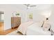 Bright bedroom with neutral decor, a ceiling fan, and a view of the closet at 3420 Sheridan Dr, Durham, NC 27707