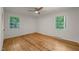 Cozy bedroom with hardwood floors offers a serene retreat filled with natural light at 3420 Sheridan Dr, Durham, NC 27707