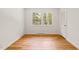 Bright bedroom with hardwood floors and a window providing natural light at 3420 Sheridan Dr, Durham, NC 27707