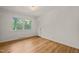 Inviting bedroom with hardwood floors and two windows allowing ample natural light at 3420 Sheridan Dr, Durham, NC 27707