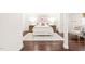 Finished basement bedroom with dark wood floors and neutral decor at 3420 Sheridan Dr, Durham, NC 27707