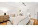 Bright bedroom with neutral decor, ceiling fan and an ensuite bathroom at 3420 Sheridan Dr, Durham, NC 27707