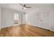 Neutral bedroom featuring hardwood flooring, closet space, and an ensuite bathroom at 3420 Sheridan Dr, Durham, NC 27707