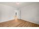 Bright bedroom with hardwood floors and an open doorway offers a welcoming space at 3420 Sheridan Dr, Durham, NC 27707