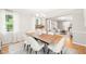 Bright dining room with a modern table setting and decor with hardwood flooring at 3420 Sheridan Dr, Durham, NC 27707