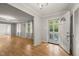 Inviting entryway boasting hardwood floors, neutral paint, and an open doorway offering a glimpse into the living room at 3420 Sheridan Dr, Durham, NC 27707