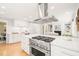 Bright, open-concept kitchen with a large island and modern stainless steel appliances at 3420 Sheridan Dr, Durham, NC 27707