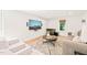 Well-lit living room showcasing modern decor, built-in entertainment system, and big TV at 3420 Sheridan Dr, Durham, NC 27707