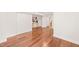 Spacious living room with hardwood floors, white trim and clean, bright paint at 3420 Sheridan Dr, Durham, NC 27707