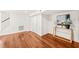 Bright living room with hardwood floors and stylish console table under the painting at 3420 Sheridan Dr, Durham, NC 27707
