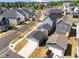 Aerial view of new homes in a well-planned neighborhood with sidewalks and landscaped yards at 353 Rivella Dr, Wake Forest, NC 27587