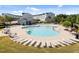 Inviting community pool with abundant lounge chairs, perfect for relaxation and recreation at 353 Rivella Dr, Wake Forest, NC 27587