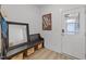 Foyer with wood bench, decorative mirror, and a stylish Grand Central Station art print at 353 Rivella Dr, Wake Forest, NC 27587
