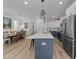 Spacious kitchen with a large island, stainless steel appliances, and a dining area, ideal for Gathering meals and gatherings at 353 Rivella Dr, Wake Forest, NC 27587