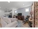 Comfortable living room with a view into an open kitchen, featuring modern decor and ample natural light, perfect for entertaining at 353 Rivella Dr, Wake Forest, NC 27587