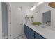 Bathroom with a double sink vanity, white countertops and blue cabinetry at 353 Rivella Dr, Wake Forest, NC 27587