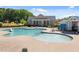 Community pool with ample seating, surrounded by lush greenery, offering a relaxing and inviting atmosphere at 353 Rivella Dr, Wake Forest, NC 27587