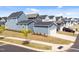 Street view of modern homes with manicured lawns, driveways, and landscaping at 353 Rivella Dr, Wake Forest, NC 27587