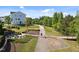View of the walking path with a fire pit, seating area, and grassy areas in the community at 353 Rivella Dr, Wake Forest, NC 27587