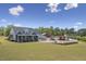 Sprawling property with a well-manicured lawn, pool, and multiple outbuildings at 3636-A Holly Grove Rd, Dunn, NC 28334