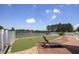 Stunning backyard with putting green, lounge chairs, and lake views for outdoor relaxation at 3636-A Holly Grove Rd, Dunn, NC 28334