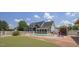Inviting backyard featuring a swimming pool, putting green, and outdoor kitchen perfect for entertaining at 3636-A Holly Grove Rd, Dunn, NC 28334