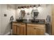 Bathroom featuring dual sinks, granite counters, custom mirrors, and modern lighting fixtures at 3636-A Holly Grove Rd, Dunn, NC 28334