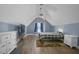 An inviting bedroom features vaulted ceilings and a decorative accent wall at 3636-A Holly Grove Rd, Dunn, NC 28334